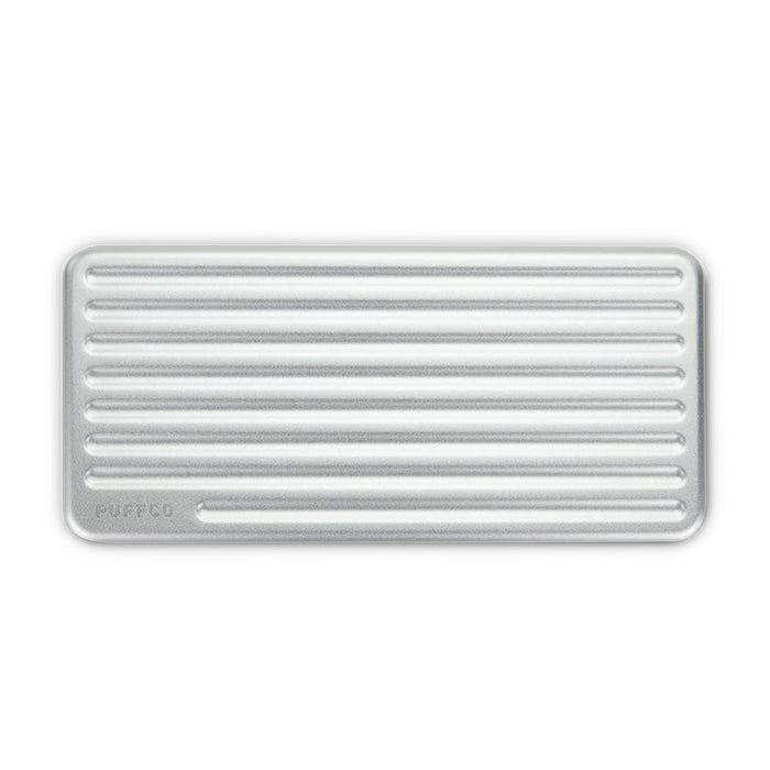 Open view of PuffCo Pivot storage case showing silicone compartments for dab tools and swabs